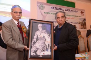 MF Husain's son presenting his father's portrait to AMU Vice Chancellor at Museology Seminar, AMU
