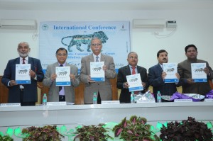 Guests and dignitaries releasing souvenir at the Conference